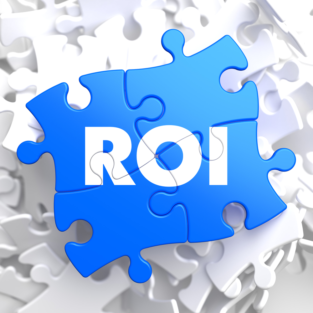 Roi Return Of Investment Written On Blue Puzzle Pieces Business Concept